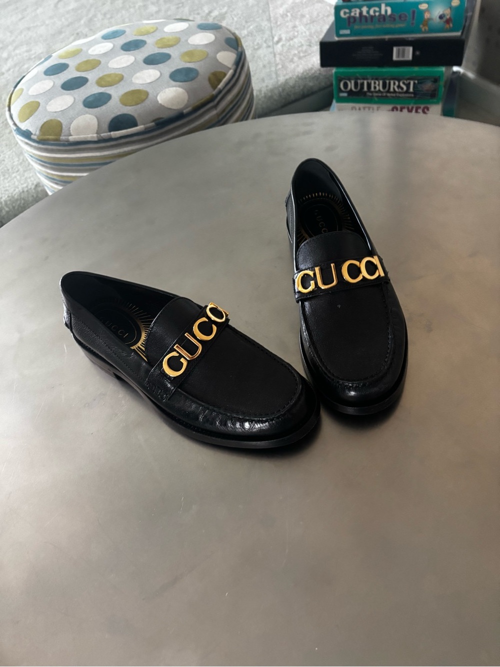 Gucci Black Leather Loafers with Gold Logo Strap